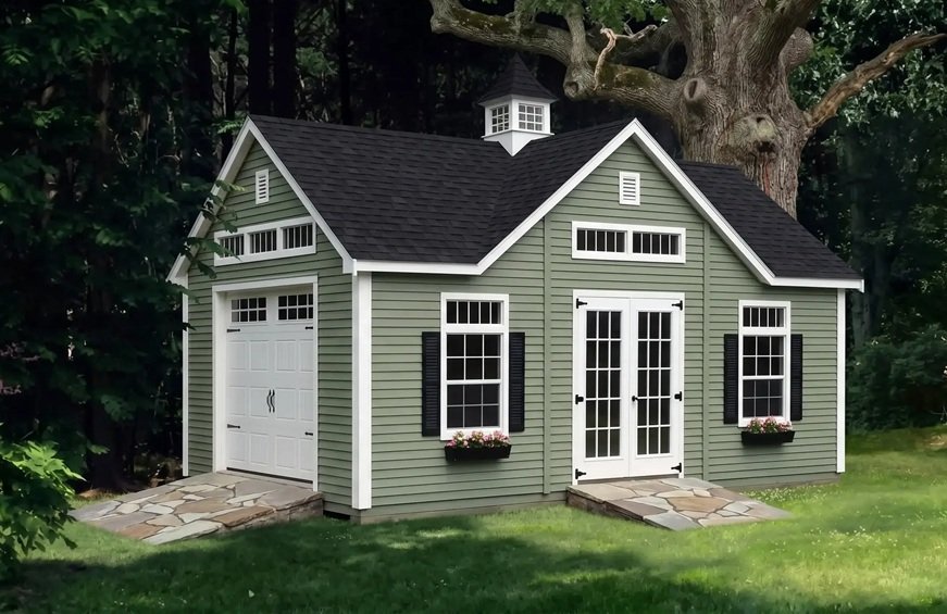 Grand Appalachian A-frame dormer building with sage green lap siding in an autumn setting